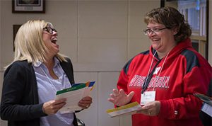 Two participants share their results during a Real Colors workshop