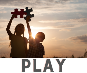 Two children at sunset holding up puzzle pieces, with the word PLAY below.