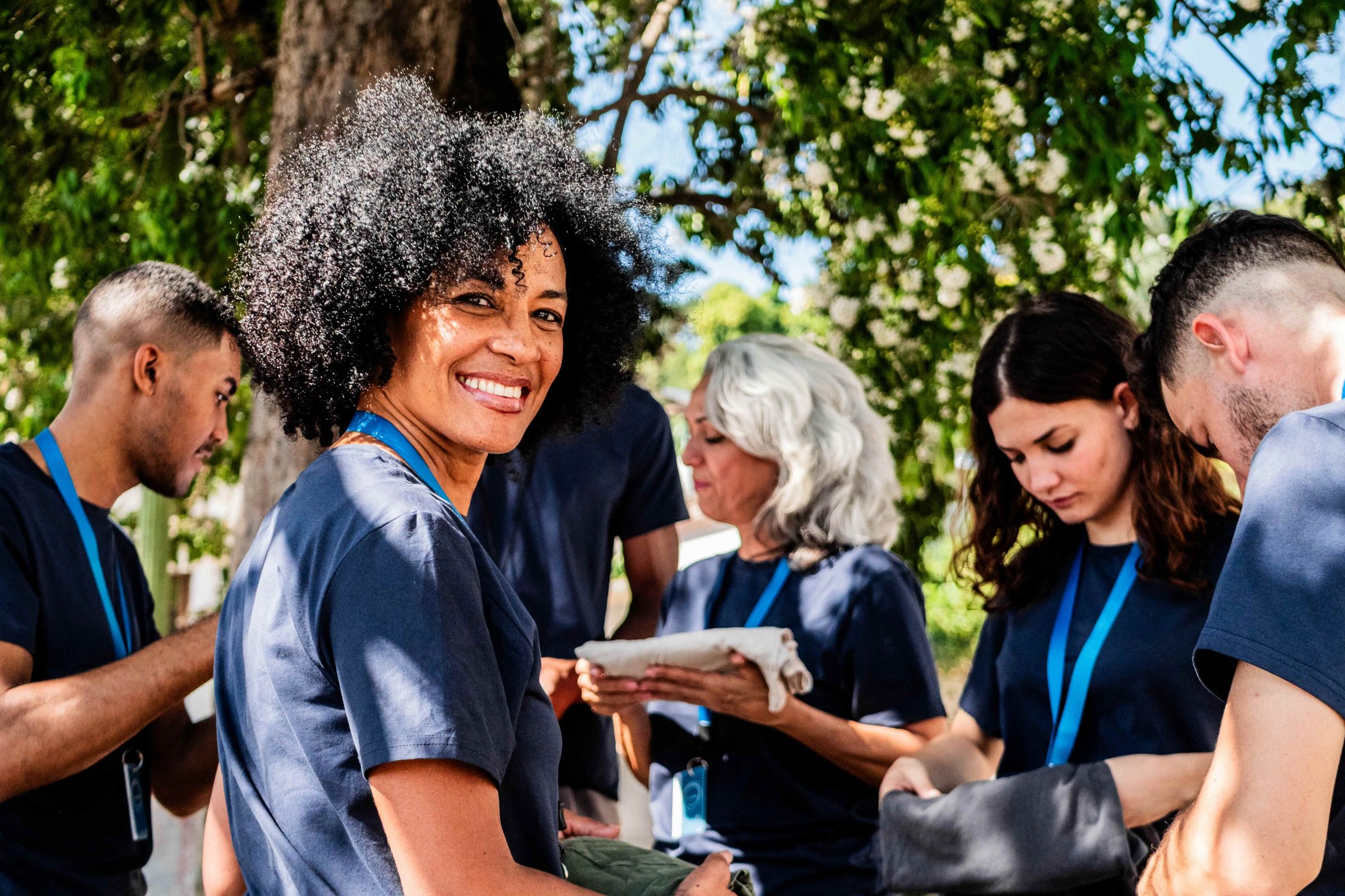 A group of volunteers works outside